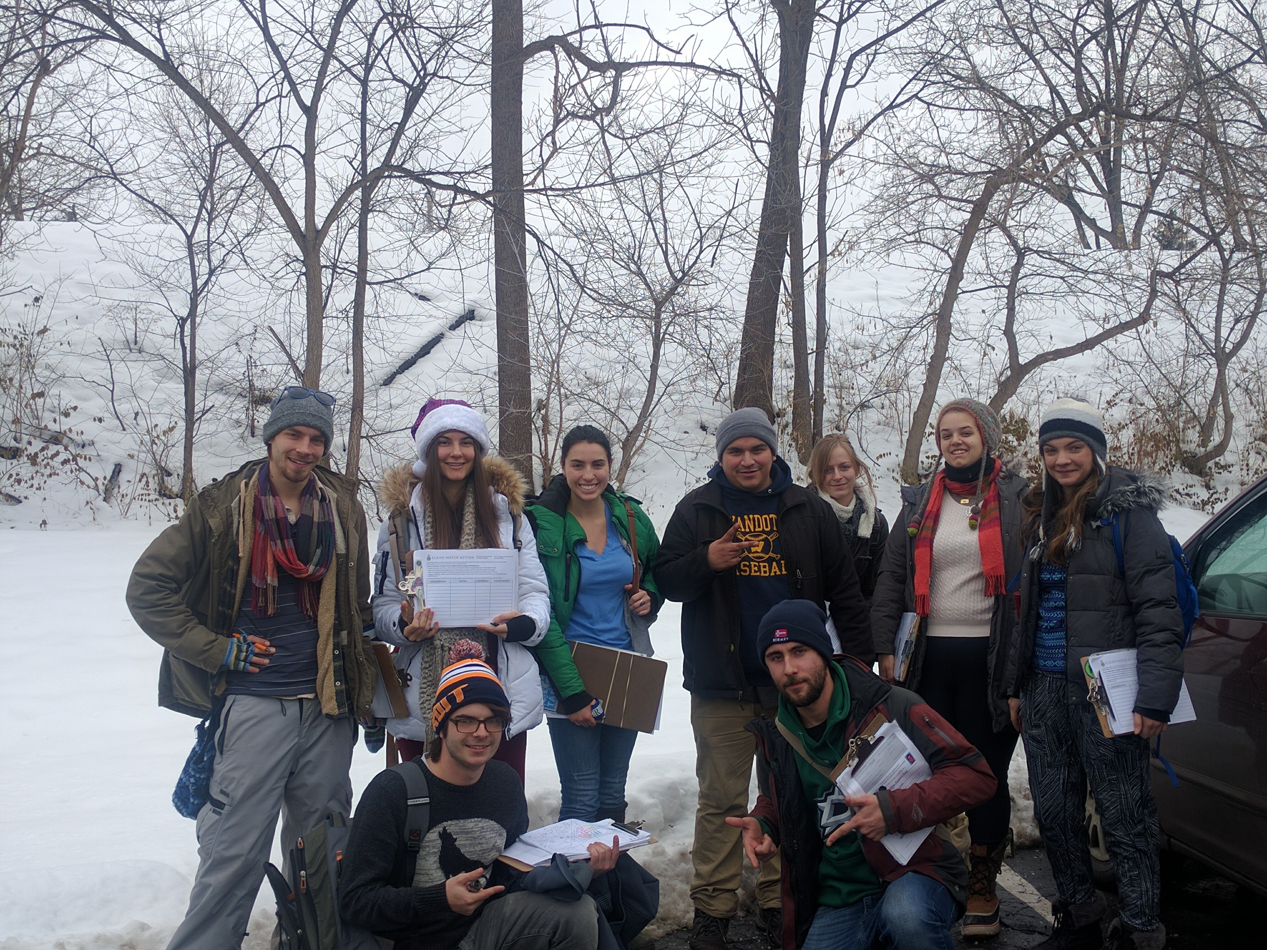 Winter 2016 Ann Arbor field canvass team posing with clipboards in the snow 