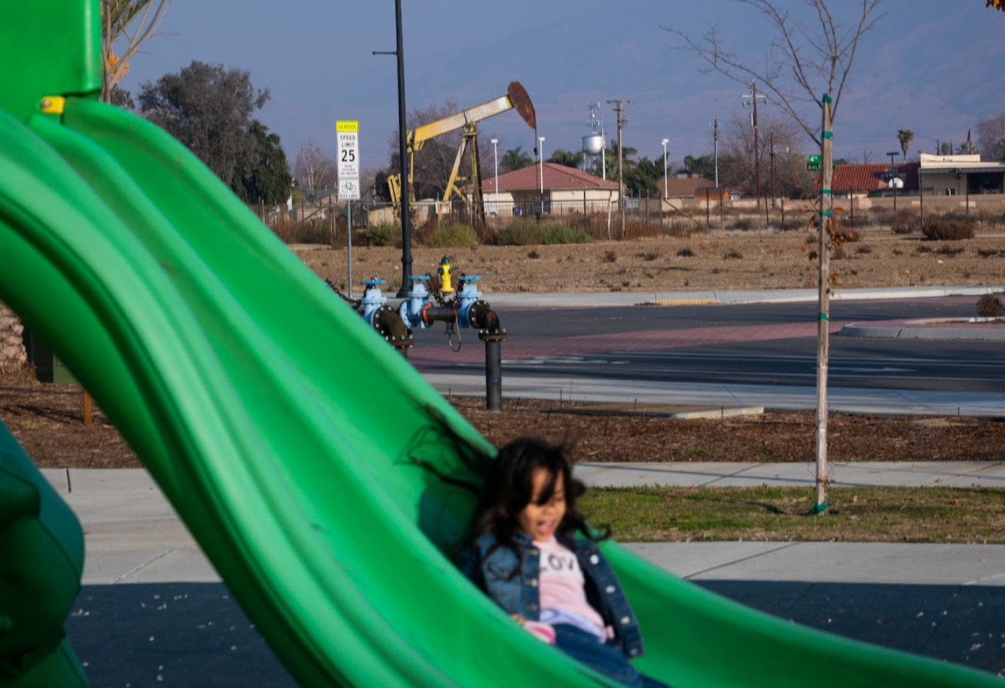 No child should have to play next to a polluting oil well.
