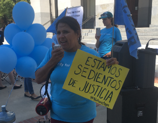 community member at safe drinking water fund rally