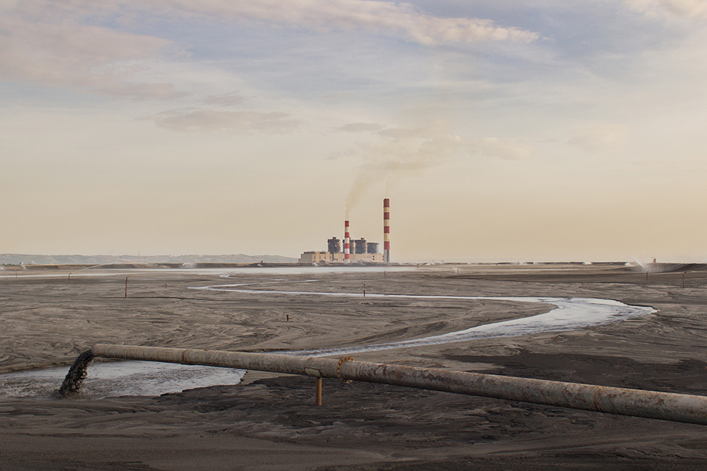 photo: coal ash pouring through a pipe / shutterstock