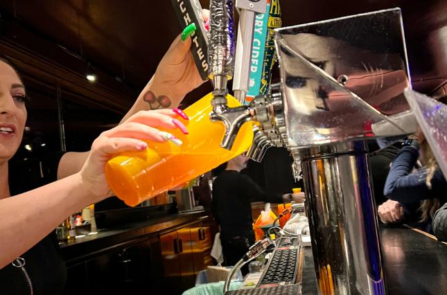 The Fillmore pouring drinks into reusable glasses