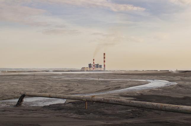 photo: coal ash pouring through a pipe / shutterstock