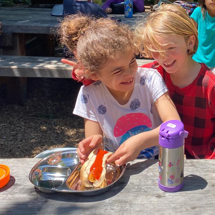 BUSD students enjoying lunch on stainless steel plates