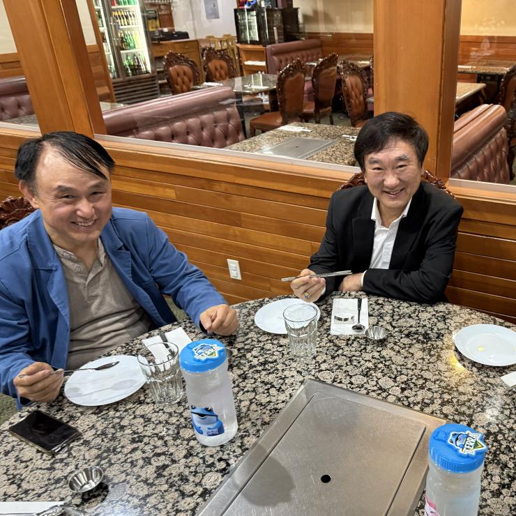 Posing with new reusable items inside the restaurant