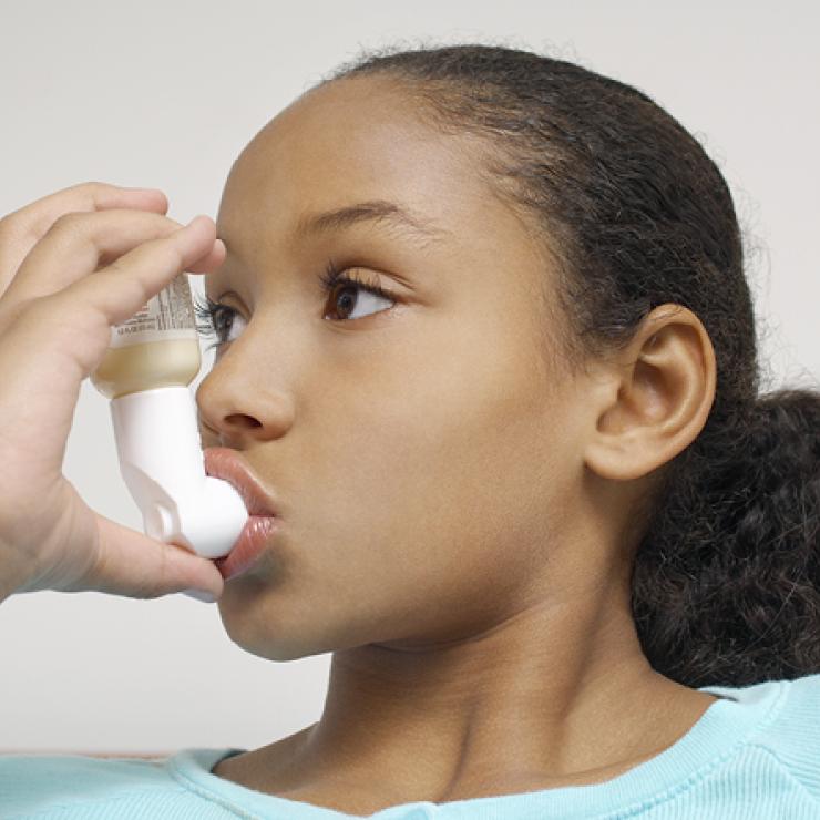 Girl using an inhaler
