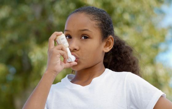 Young girl with inhaler
