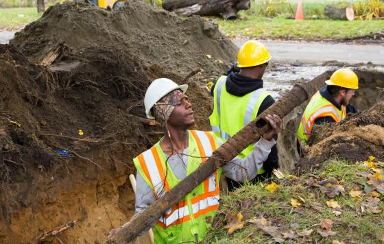 Workers replacing lead service lines.