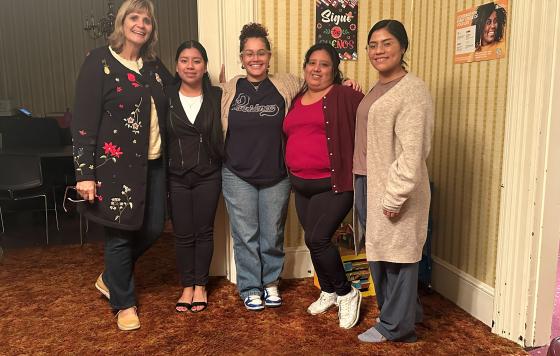 Caption: Energy Efficiency Outreach Specialist Shay Brooks (center) and Clean Water Intern Luisa Raymundo (second from left) with New Bedford’s Community Economic Development Center team members. 