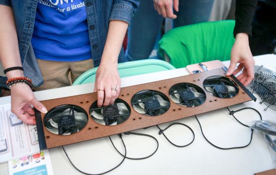 Attendees visiting the Mothers Out Front East Boston table learned to build their own air filtration system. (Photo credit Angela Rowlings)