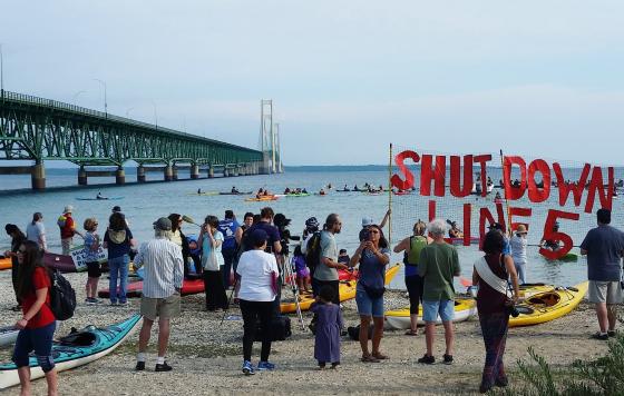 Shut Down Line 5 flotilla protest assembling under the Mackinac Bridge