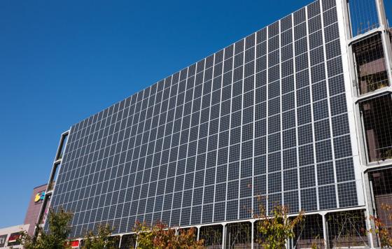 Solar panels on the side of a building. Credit: yoshi0511 / Shutterstock