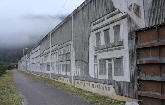 Flood wall in Matewan, WV commemorating the Mine Wars, photo: Neil Bhaerman